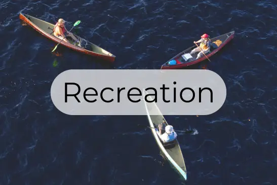 3 canoes in a lake